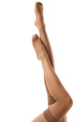 Female legs in nude stockings - obrazy, fototapety, plakaty