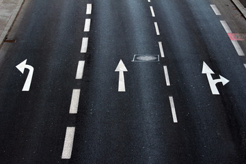 detail of asphalt surface with traffic symbols