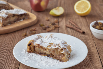 Fresh baked homemade apple strudel with powdered sugar