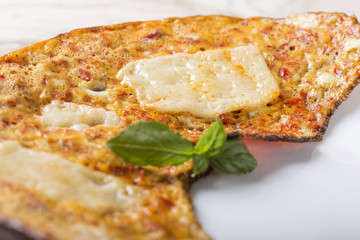 Fresh omelette made from cheese and red bell peppers
