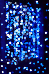 Night city lights bokeh background. Defocused bokeh lights. Blurred bokeh. Bokeh light background. Abstract blue.