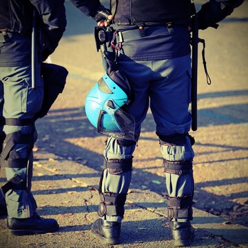 police in riot gear with protective helmet during the revolt of