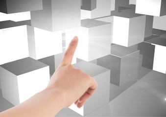 Composite image of Hand touching white cubes