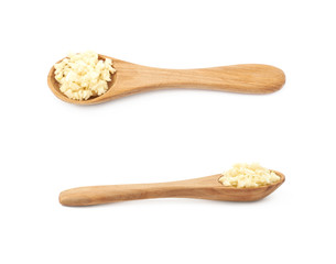 Spoon of minced garlic isolated
