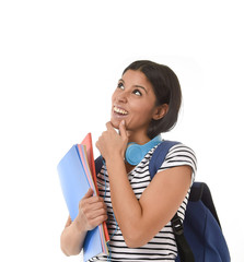young beautiful and trendy latin student girl holding notepad folder and book carrying backpack thinking happy