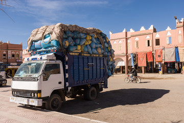 Little truck loaded high at Agdz, Morocco