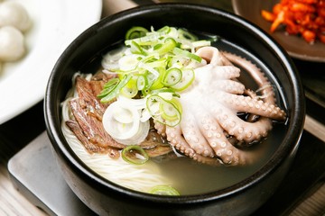 beef and small octopus rice soup. This food is Korean cuisine.