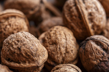 Background of group close walnuts. Close-up or macro photo. 