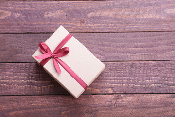 Gift boxes with bow on wood background