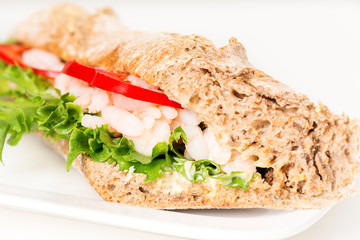 Prawn sandwich on white plate macro