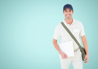 Smiling man looking at camera against a light blue background