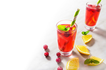 Cranberry lemonade decorated with mint with half isolated background