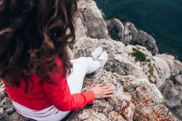 on the edge of the rock