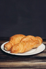 croissants on a wooden background