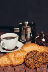 croissants round cookies with a cup of coffee