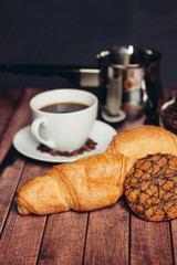 cup of coffee turk and croissants with cookies on saucer