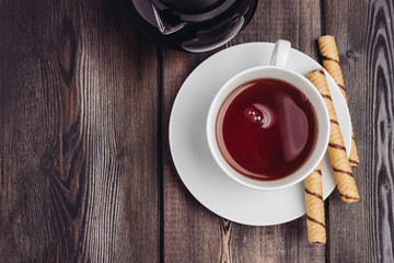 cup with a drink and sweet chopsticks