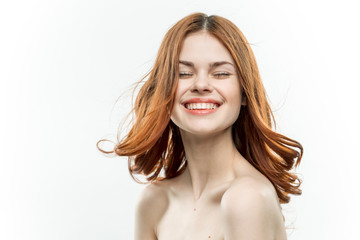 happy red-haired woman closed her eyes, bright teeth