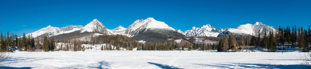 Panorama of frozen Strbske Pleso with High Tatras mountains, Slovakia