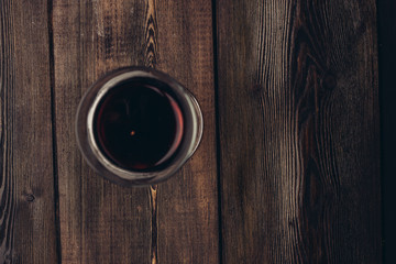 cup with a drink on a wooden background