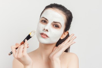 makeup brush in hand, mask for cleansing