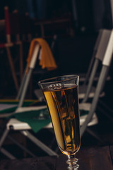 a glass with a drink, a chair and napkins