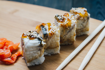 traditional Japanese food, chopsticks, wooden background