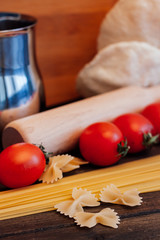 rolling pin, macaroni, cherry tomatoes