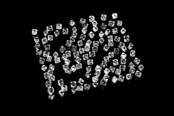 natural transparent diamonds in macro on black background