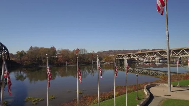 Aerial Shot Ascending Past Flags in Flag Park