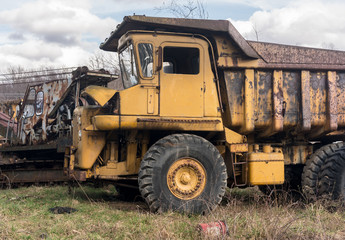 Fototapeta na wymiar Abandoned heavy construction truck