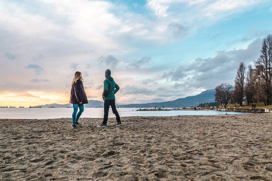 Couple At English Bay Beach Park In Vancouver, Canada