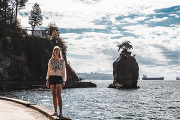 Fototapeta na wymiar Girl near Siwash Rock in Vancouver, BC, Canada