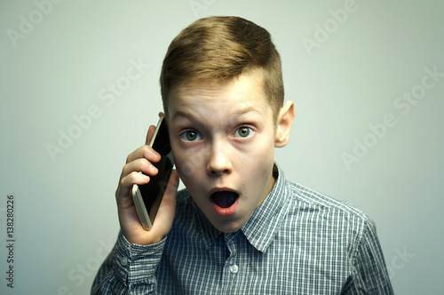 Angry Teenage Boy Talking On Smartphone Stock Photo And Royaltyfree