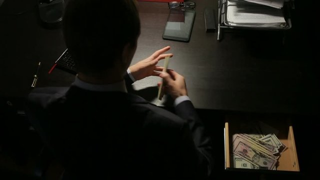 corruption, bribery and fraud concept - close up of businessman taking money