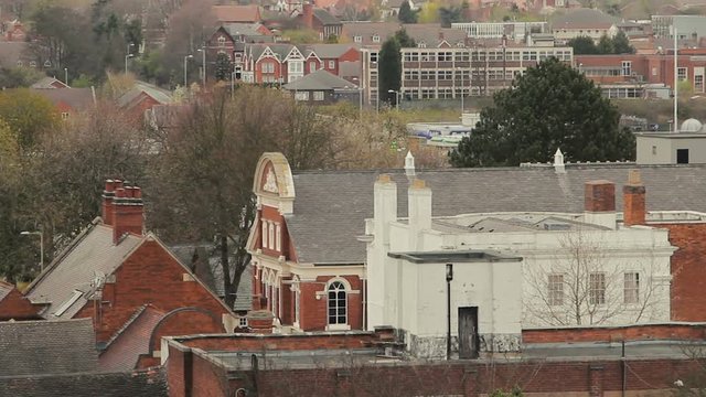 Tamworth Rooftops are a mixture of whitewashed buildings, red brick houses and grey tiles, whilst trees poke themselves up around the urban settlement.
