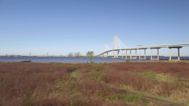 Aerial Shot Zooming Across the Land and Marsh toward Cooper River and Ravenel Br