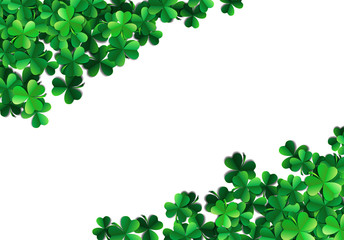 Fototapeta premium Saint Patricks day background with sprayed green clover leaves or shamrocks