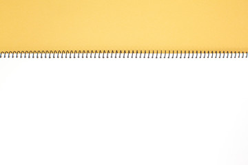 Yellow note book isolated on a white background