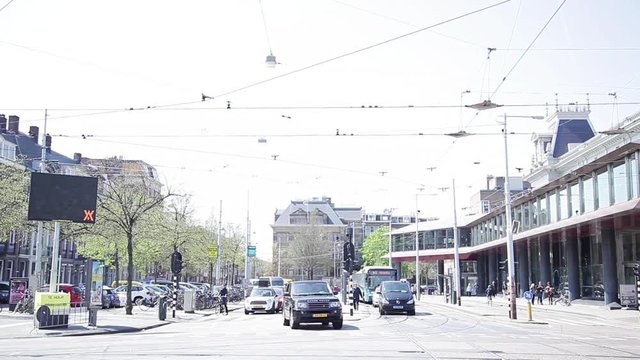 Cars and other vehicles share the road with bicycles in Amsterdam, Netherlands