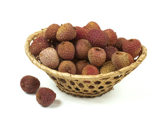 Some lychee in a fruit basket isolated on  white