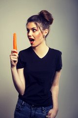 Happy Healthy Woman Holding Carrot