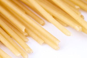Raw spaghetti on white background