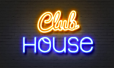 Club house neon sign on brick wall background.