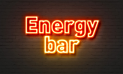 Energy bar neon sign on brick wall background.