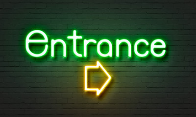 Fototapeta premium Entrance neon sign on brick wall background.