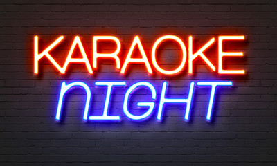 Naklejka na ściany i meble Karaoke night neon sign on brick wall background.