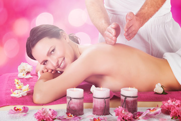Obraz na płótnie Canvas Woman Receiving Back Massage At Spa