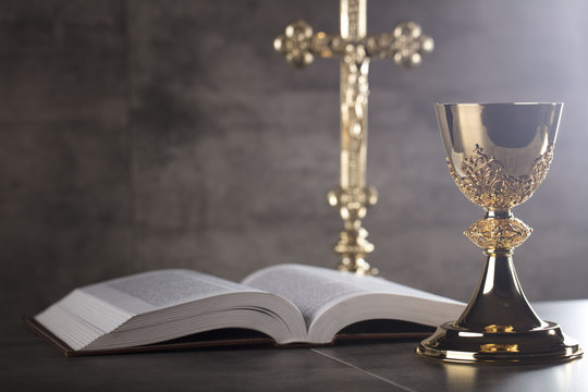 Chalice, Bible and altar cross.