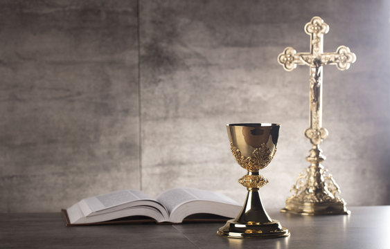 Chalice, Bible and altar cross.